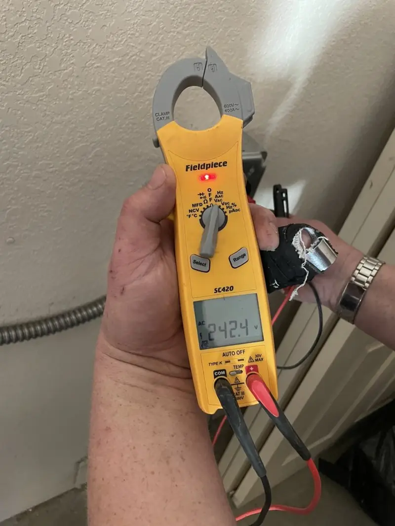 Voltage testing with clamp meter during Ceiling Fan Installation in Millcreek